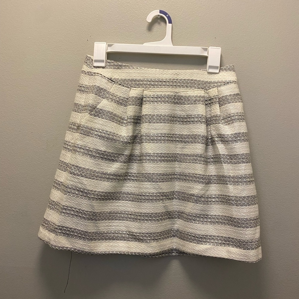 Short cream, black with gold detail lined skirt. Worn once, dry cleaned w/ tag.